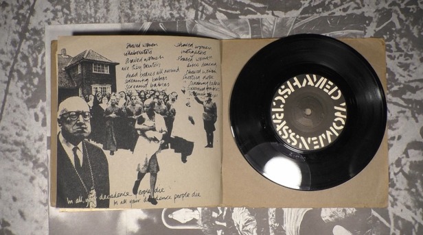Original release of Reality Asylum record on Crass Records, showing the inner sleeve, with lyrics of Shaved Women and vinyl seven-inch